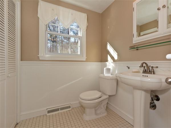 93 Allen Road Billerica, MA 01821 - Photo 23 of 25 a bathroom with a sink and a toilet