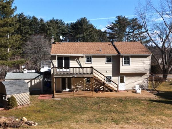 93 Allen Road Billerica, MA 01821 - Photo 25 of 25 a front view of a house with a garden and tree