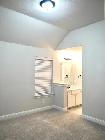 an empty room with windows and entrance