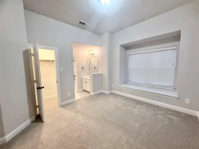 a bathroom with a tub sink mirror and toilet