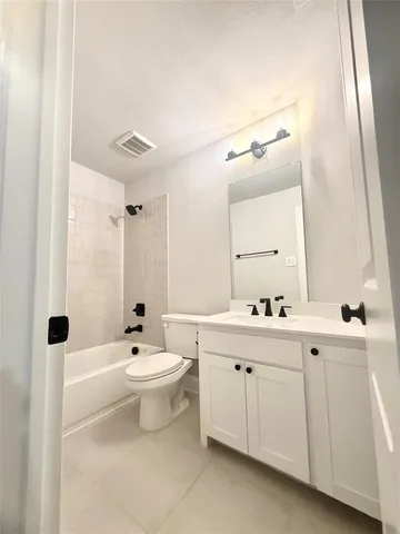a view of a room with wooden floor and a window