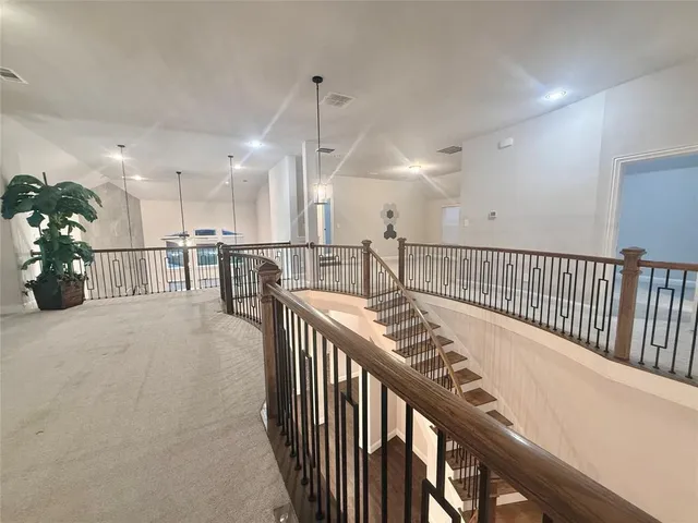 a view of a hallway with seating area