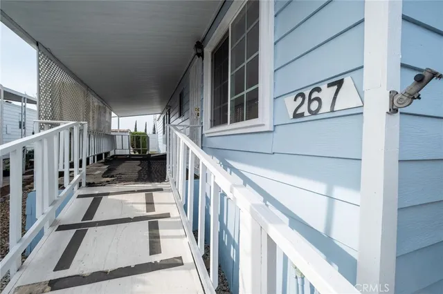a view of a chairs and table in a backyard