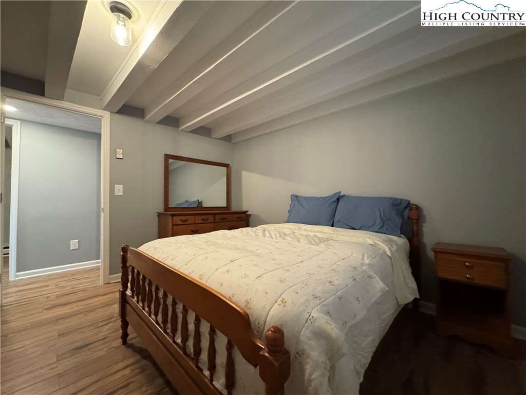 321 Skin Camp Creek Road Todd, NC 28684 - Photo 13 of 29 a bedroom with a bed and a tv