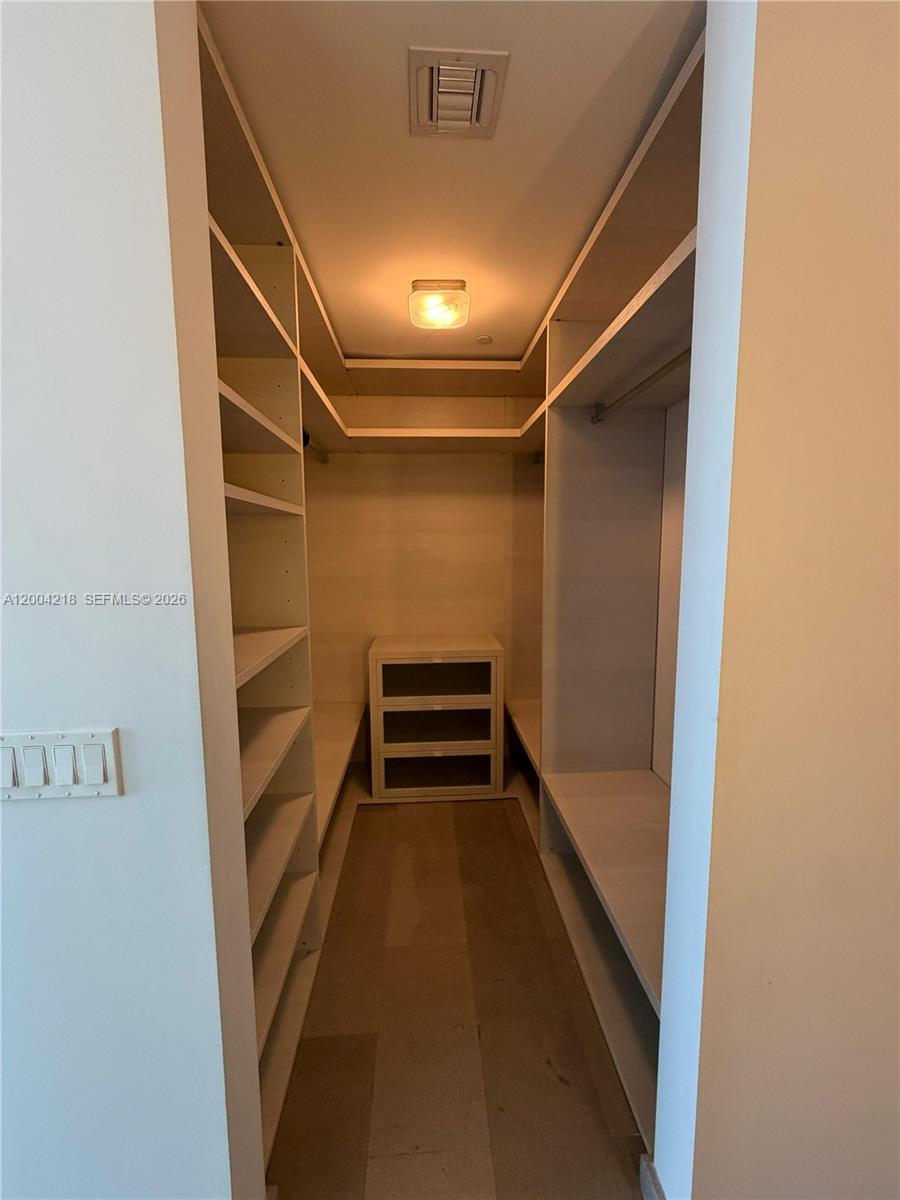 68 Southeast 6th Street, Unit 2506 Miami, FL 33131 - Photo 13 of 16 a view of walk in closet
