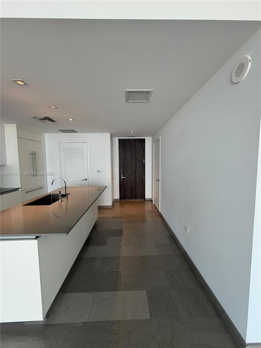 68 Southeast 6th Street, Unit 2506 Miami, FL 33131 - Photo 3 of 16 a living room with furniture and a window