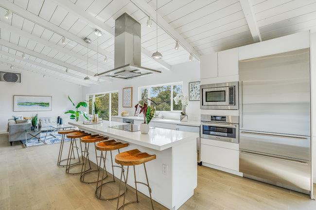 908 Holly Road Belmont, CA 94002 - Photo 15 of 50 a kitchen with stainless steel appliances granite countertop a stove and a refrigerator
