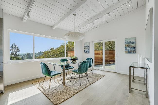 908 Holly Road Belmont, CA 94002 - Photo 17 of 50 a dining room with furniture a rug and wooden floor