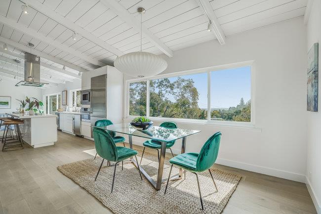 908 Holly Road Belmont, CA 94002 - Photo 18 of 50 a dining room with furniture a chandelier and wooden floor