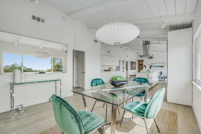 908 Holly Road Belmont, CA 94002 - Photo 19 of 50 a view of a dining room with furniture window and wooden floor