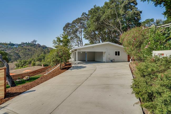 908 Holly Road Belmont, CA 94002 - Photo 2 of 50 a house with trees in front of it