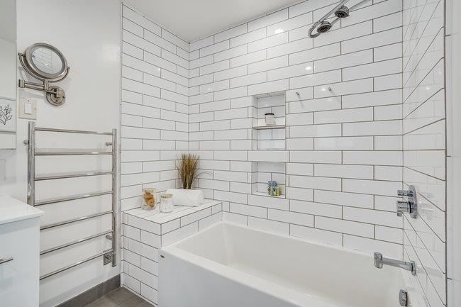 908 Holly Road Belmont, CA 94002 - Photo 22 of 50 a bathroom with a bathtub