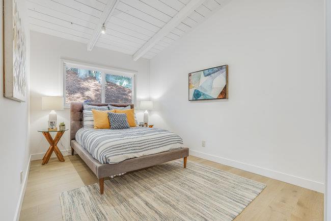 908 Holly Road Belmont, CA 94002 - Photo 26 of 50 a bedroom with a bed and wooden floor