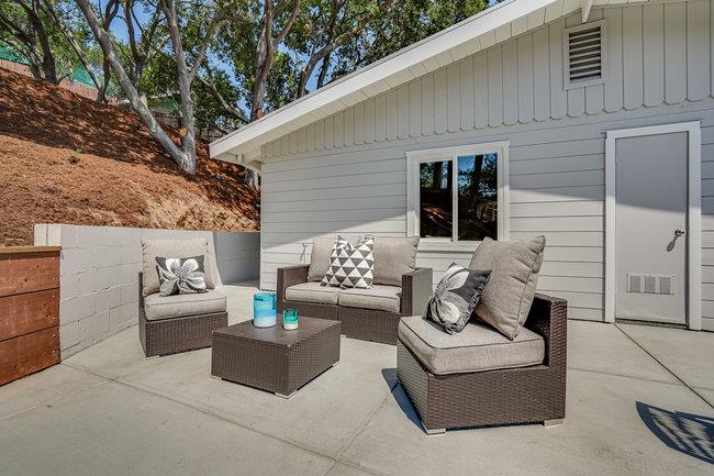 908 Holly Road Belmont, CA 94002 - Photo 31 of 50 a view of a patio with couches and potted plants