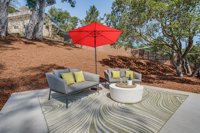908 Holly Road Belmont, CA 94002 - Photo 37 of 50 a view of a patio with a table and chairs