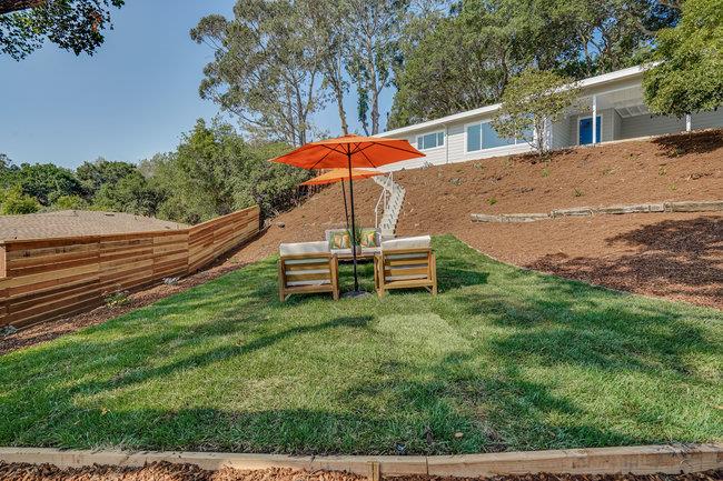 908 Holly Road Belmont, CA 94002 - Photo 41 of 50 a backyard of a house with table and chairs