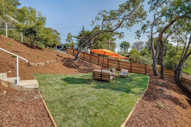 908 Holly Road Belmont, CA 94002 - Photo 42 of 50 a view of a backyard with wooden fence