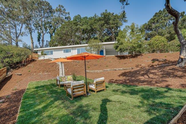 908 Holly Road Belmont, CA 94002 - Photo 44 of 50 a backyard of a house with table and chairs