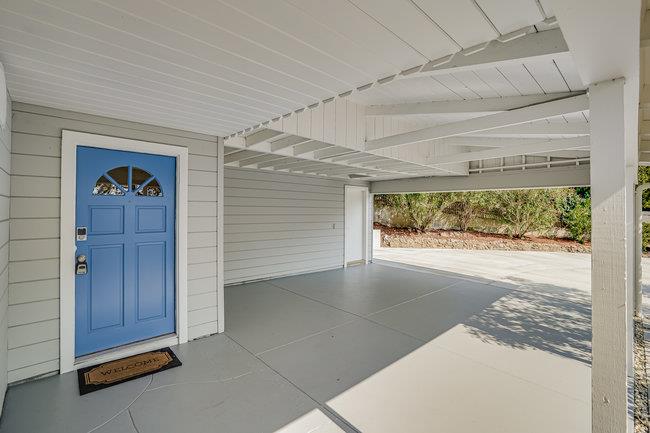 908 Holly Road Belmont, CA 94002 - Photo 6 of 50 a view of an empty room with a window