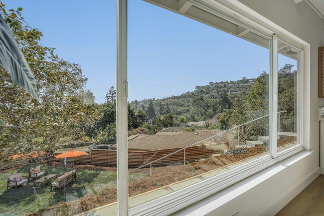 908 Holly Road Belmont, CA 94002 - Photo 9 of 50 a view of a house with a tree