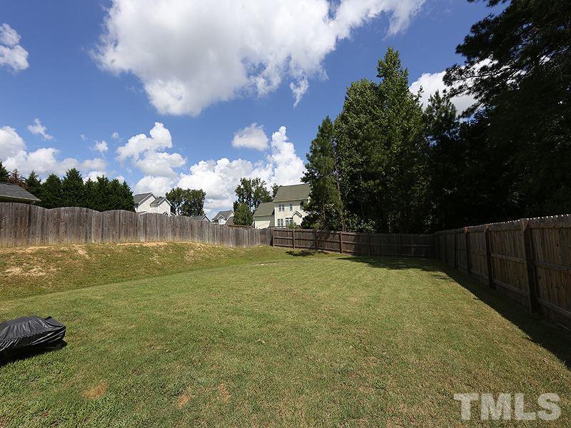 69 Arbor Loop Angier, NC 27501 - Photo 12 of 13 Nice size backyard fenced in and wetland behind so very private Not in a flood zone