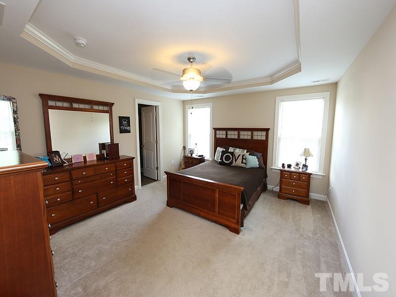 69 Arbor Loop Angier, NC 27501 - Photo 5 of 13 Large master bedroom with tons of light and trey ceiling