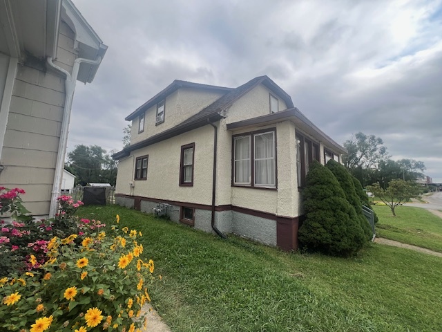 312 North 5th Avenue Kankakee, IL 60901 - Photo 2 of 22 a front view of a house with garden
