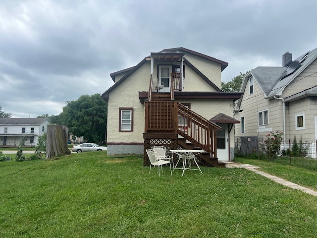 312 North 5th Avenue Kankakee, IL 60901 - Photo 22 of 22 a front view of house with a garden and patio