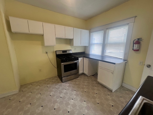 312 North 5th Avenue Kankakee, IL 60901 - Photo 8 of 22 a kitchen with stainless steel appliances a stove a sink and a refrigerator