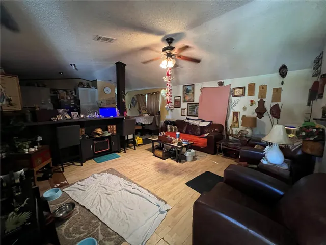 a bed room with furniture and a flat screen tv