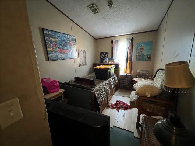 a living room with furniture and a lamp