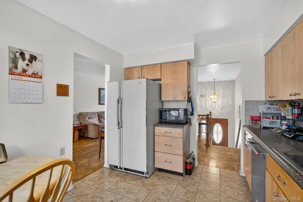 a kitchen with stainless steel appliances a refrigerator and a stove top oven