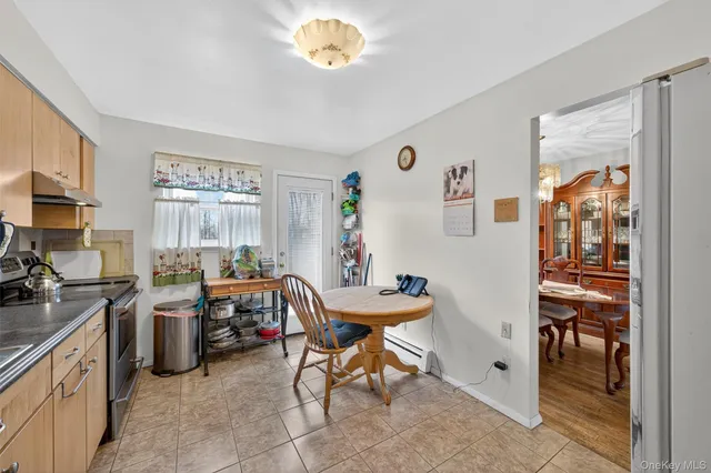 a room with furniture a chandelier and a window
