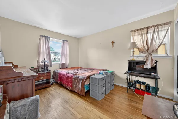 a bedroom with a bed and a desk