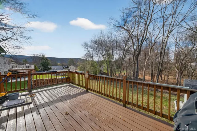 a view of balcony with wooden floor