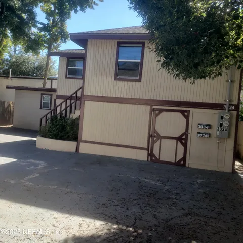 a view of backyard from wooden door