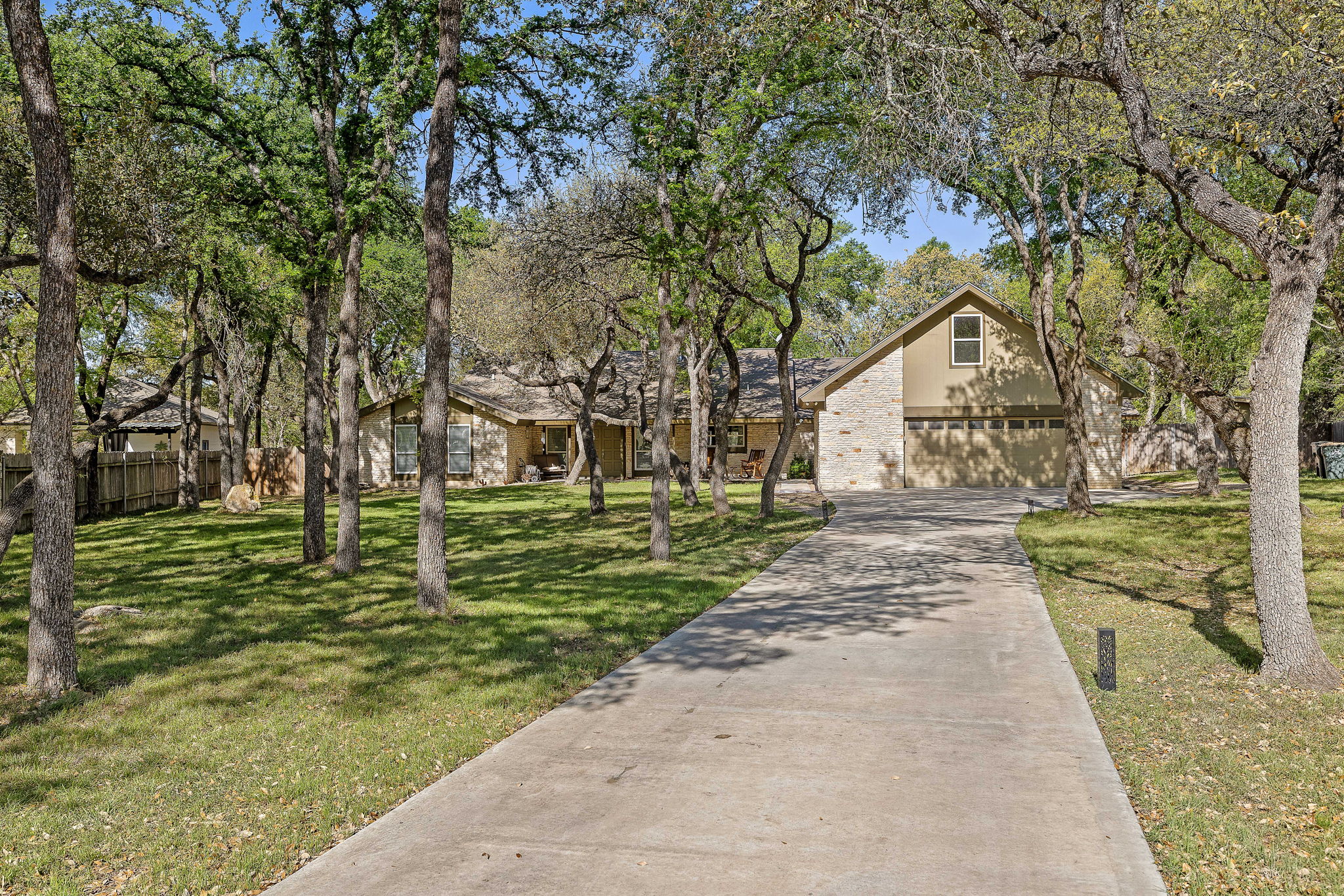 View of front facade with driveway and a garage