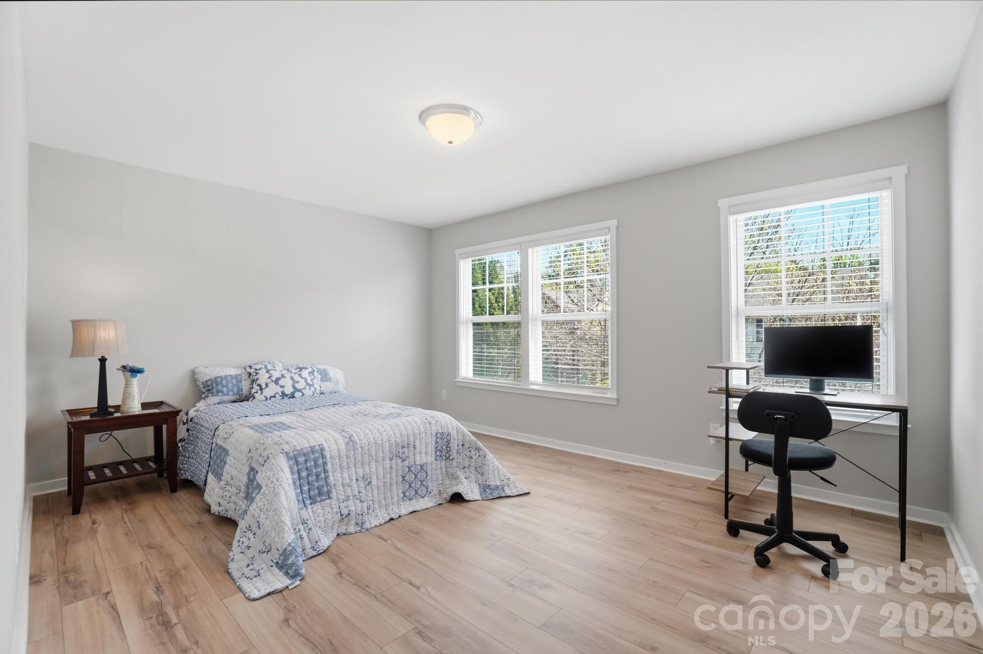 2153 Bluebell Way Tega Cay, SC 29708 - Photo 42 of 48 a bedroom with a bed and a desk