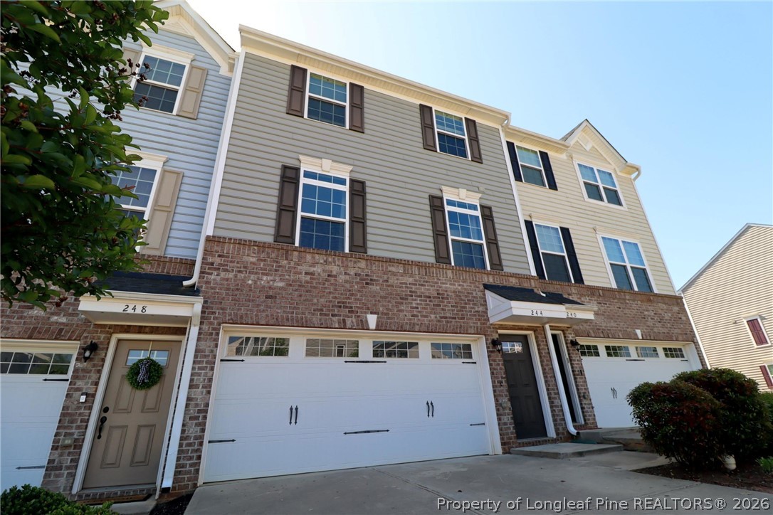 a view of a house with a sink and a yard