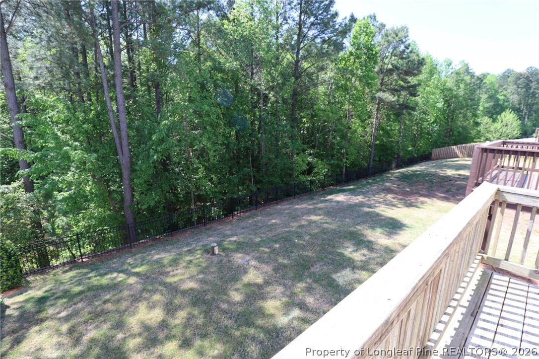 244 Amber Acorn Avenue Raleigh, NC 27603 - Photo 18 of 50 a view of a backyard with trees