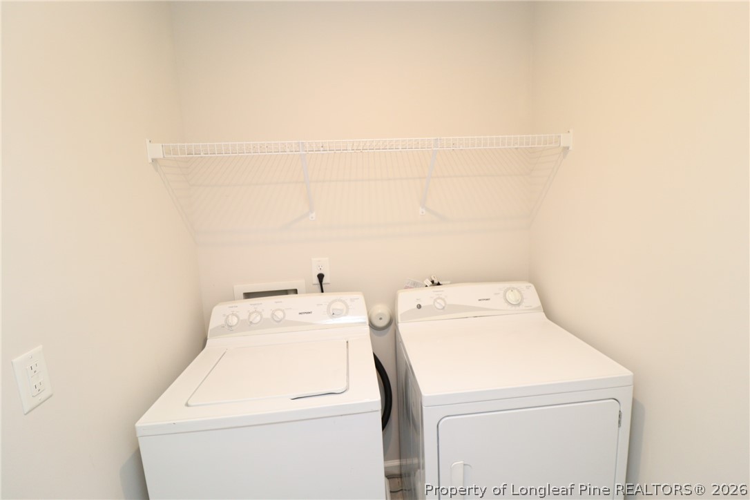 244 Amber Acorn Avenue Raleigh, NC 27603 - Photo 20 of 50 a utility room with dryer and washer