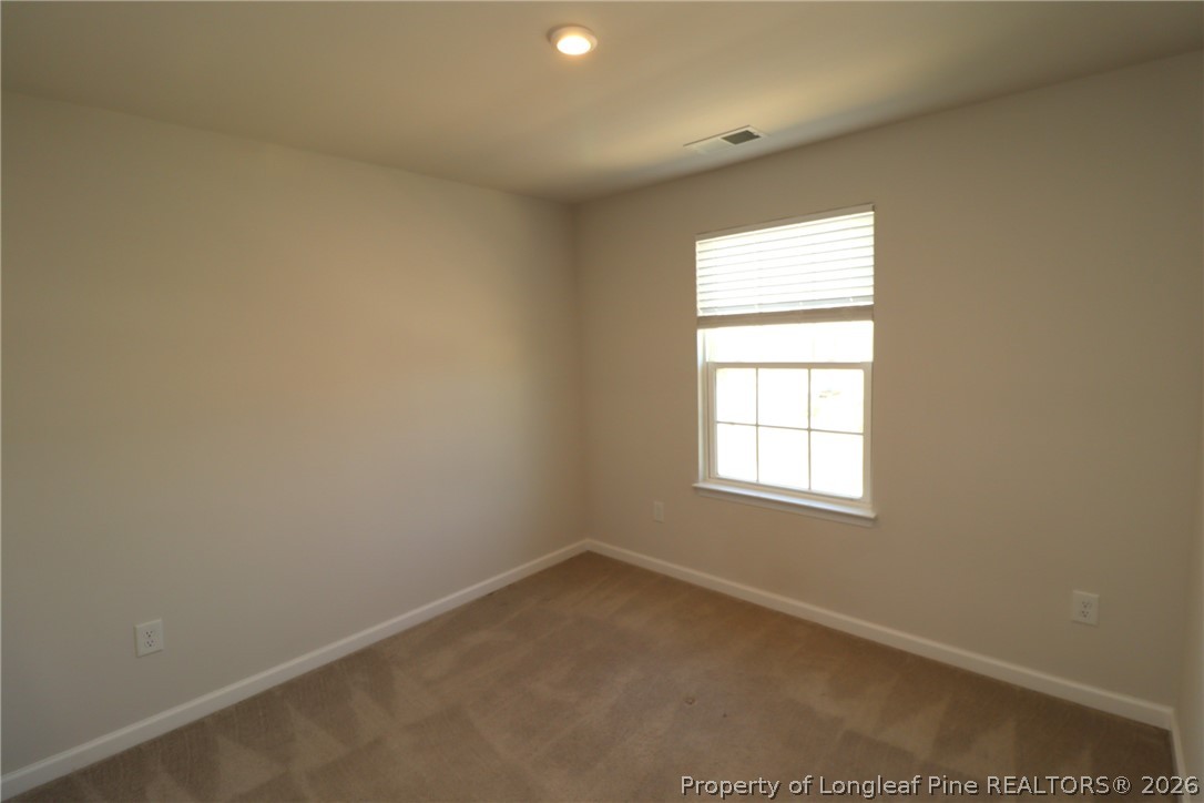244 Amber Acorn Avenue Raleigh, NC 27603 - Photo 28 of 50 an empty room with a window