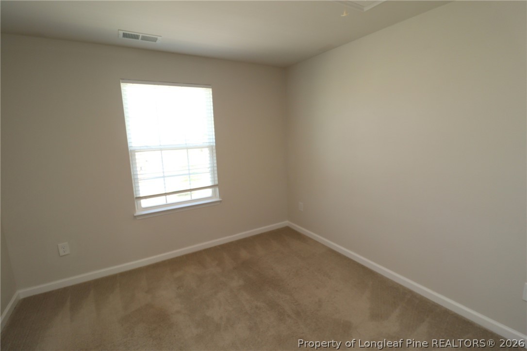 244 Amber Acorn Avenue Raleigh, NC 27603 - Photo 30 of 50 an empty room with a window