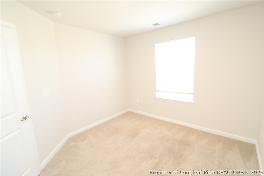 244 Amber Acorn Avenue Raleigh, NC 27603 - Photo 31 of 50 a view of a small space with a window