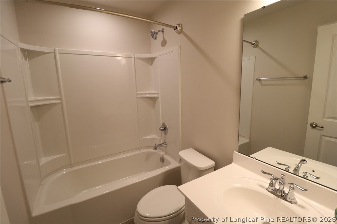 244 Amber Acorn Avenue Raleigh, NC 27603 - Photo 33 of 50 a bathroom with a sink toilet and shower