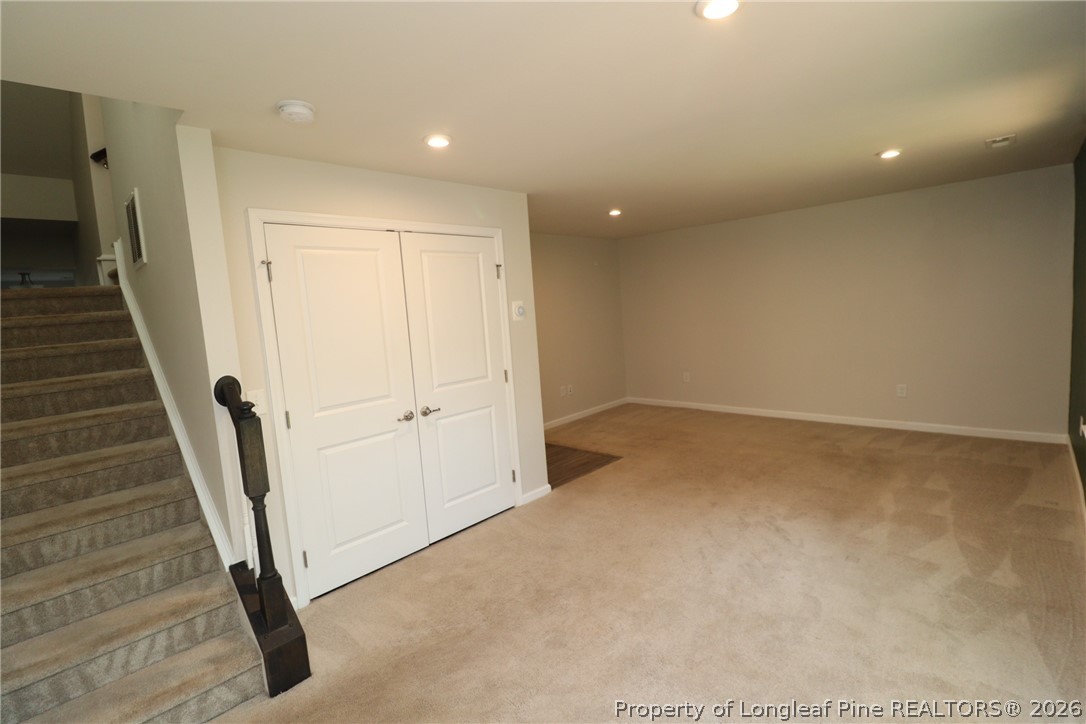 244 Amber Acorn Avenue Raleigh, NC 27603 - Photo 36 of 50 a view of a hallway with staircase
