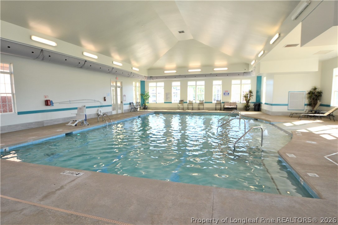 244 Amber Acorn Avenue Raleigh, NC 27603 - Photo 37 of 50 a large swimming pool with a large window