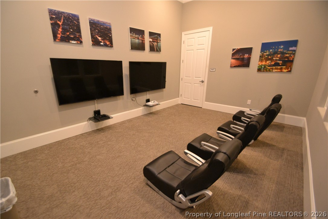 244 Amber Acorn Avenue Raleigh, NC 27603 - Photo 39 of 50 a living room with furniture and a flat screen tv