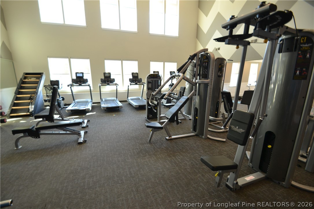 244 Amber Acorn Avenue Raleigh, NC 27603 - Photo 43 of 50 a view of a room with gym equipment