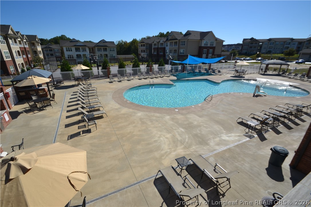 244 Amber Acorn Avenue Raleigh, NC 27603 - Photo 50 of 50 a view of swimming pool outdoor seating and city view